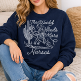 Woman wearing a navy sweatshirt with a graphic and text, sitting on a couch.